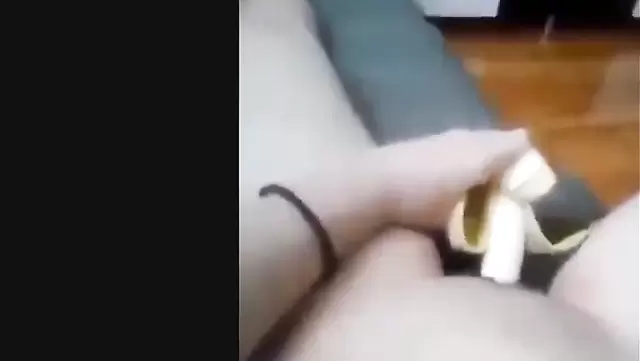 Asian girl masturbates with banana
